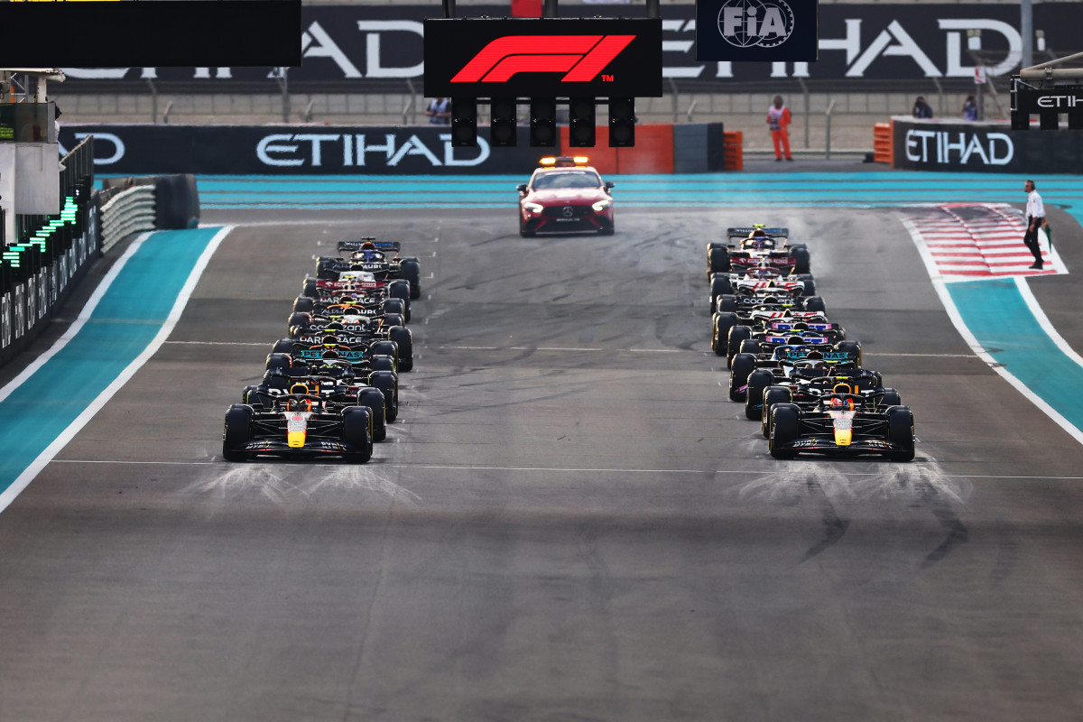 Teams lined up on grid to start racing(Taken from: https://www.esquireme.com/sports/what-is-the-car-at-the-back-of-the-f1-grid)